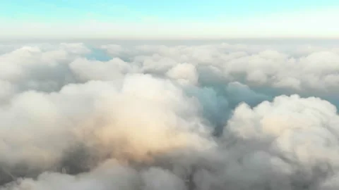 Thick white clouds flying sideways over the city landscape, evening scene Stock Footage 157814858