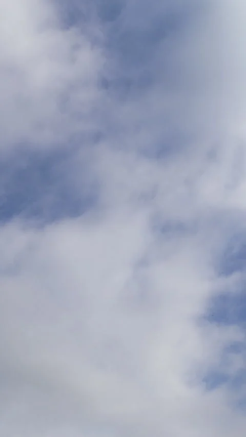 Thick White Clouds Moving Across Blue Sky Time Lapse Vertical Vídeos de archivo 345937925