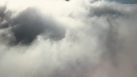 Thick white clouds in the sky and the tip of the mountain Stock Footage 91185317