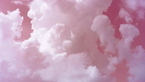 Thick white clouds swirl like smoke in the pink sky. Time laps. Stock Footage 142080495