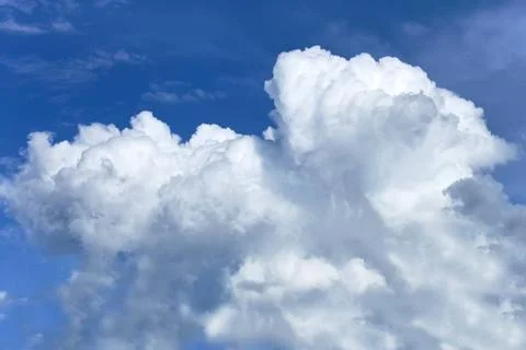 Thick white clouds Thick white clouds against a background of a blue sky C... Stock-Fotos