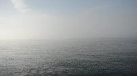 Thick white fog floating over blue fjord surface in autumn Stock Footage 54776016