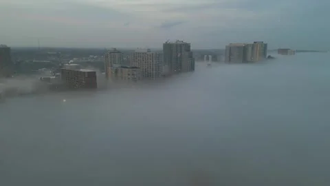 Thick White Fog Rolling Through The Lakefront High Rise Buildings In Downtown Stock Footage 340044506