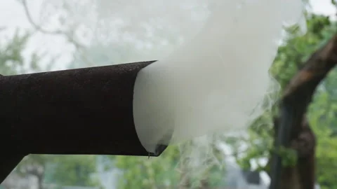 Thick white smoke comes out of the chimney. Stock Footage 132644486