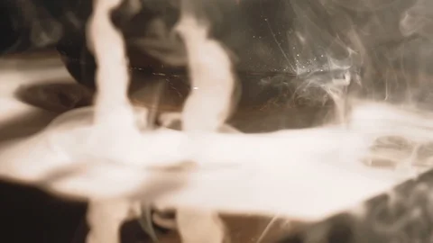 Thick white smoke from a hookah on a black background Stock Footage 105458516