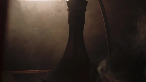 Thick white smoke from a hookah on a black background Stock Footage 105459355