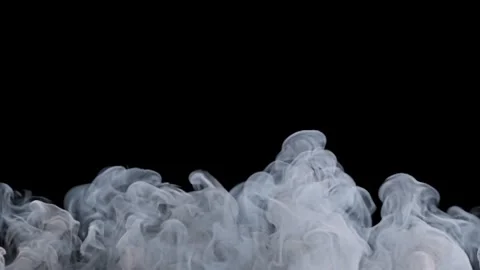 Thick white smoke rising slowly on black background. Stock Footage 337526335