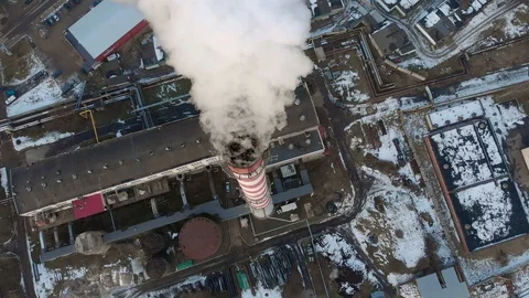 Thick white smoke spilling from the pipe above the city.  Stock Footage 102702972