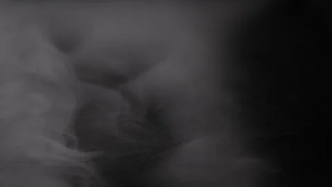 Thick white smoke surges continuously into frame from the left side. Stock Footage 337411571