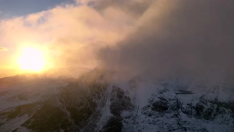 Thick winter clouds in a mountainous landscape at sunrise Vídeo Stock 233682272