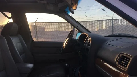 Thief Breaks Into Car with Bar  動画素材 98952944