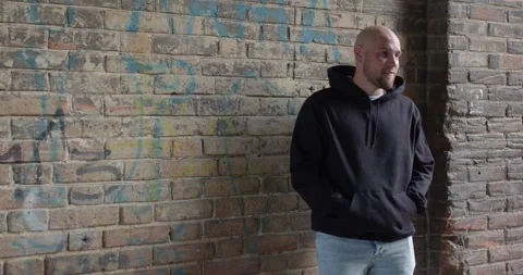 Thief commits robbery attack on black man, day time. frightened man is being Video stock 264473161