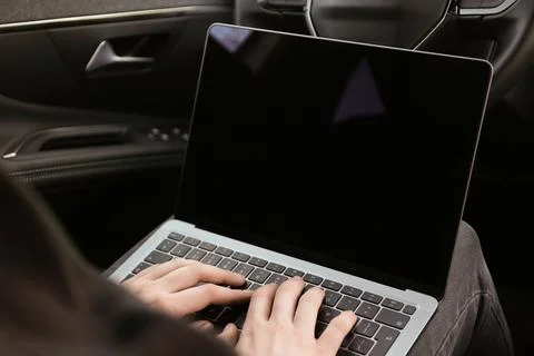 Thief hacking car system with laptop inside vehicle, closeup Stock Photos