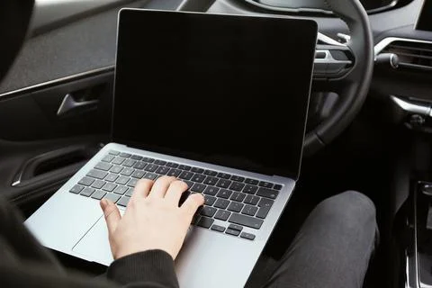 Thief hacking car system with laptop inside vehicle, closeup Stock Photos