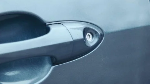 The thief hacks the door lock in the car Stock Footage 100535714