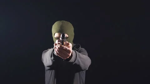 Thief man on black background commits robbery. 스톡 동영상 227571544