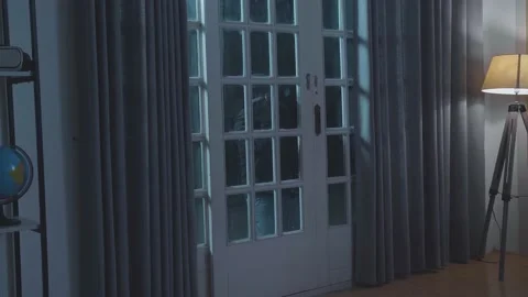 Thief Man Holding Flashlight Looking Inside The House While Standing Outside Video stock 197377792