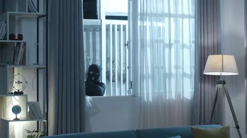 Thief Man Holding Flashlight Opening Window And Entering Someone'S Video stock 197375880
