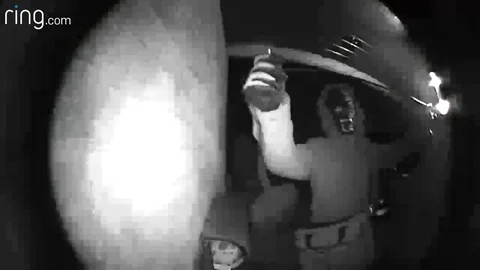 Thief in monkey mask trips over after attempt to steal BMW by holding bag up ... Stock Footage 109249937