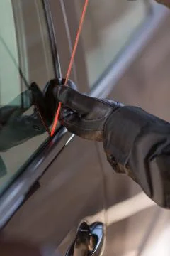 Thief opening a car Foto stock