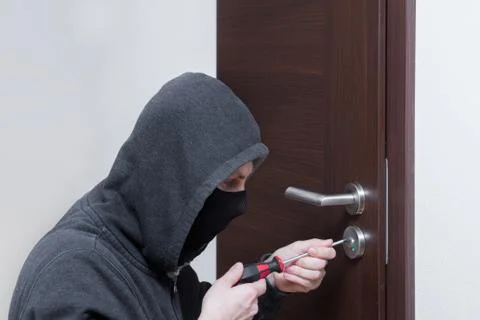 Thief opening lock Stock Photos