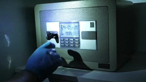 The thief is opening a safe with numerical keypad in the night 스톡 동영상 277592901