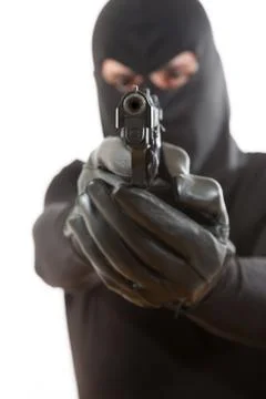 Thief pointing a gun Stock Photos
