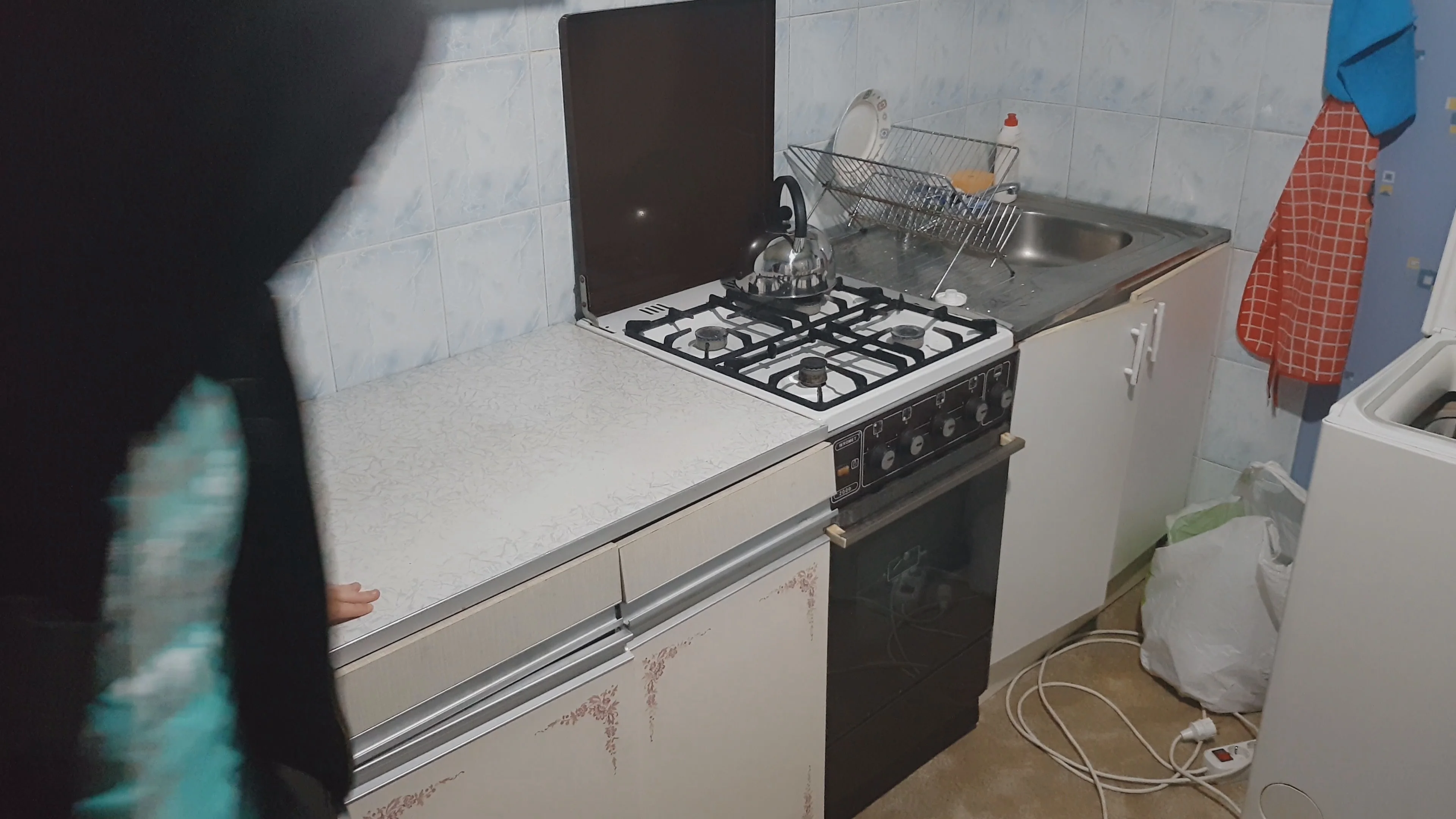 Thief rushing into kitchen and looking for things to steal, hidden camera video
