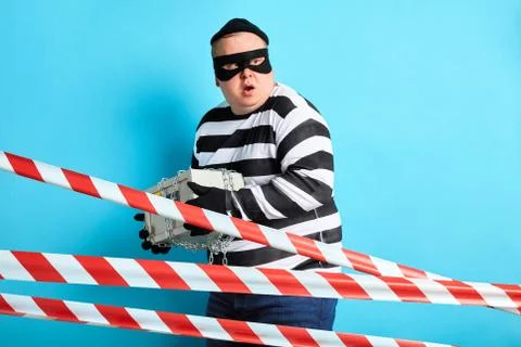 Thief with a safe going to run away Stock Photos
