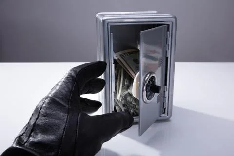 Thief Stealing Banknotes From Open Safe Stock Photos