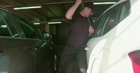 Thief stealing a car Stock Footage 201734442