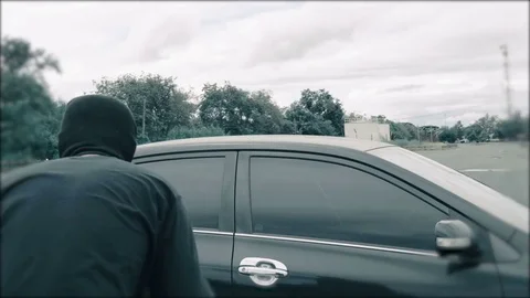 Thief Steals A Car Breaking Entering Alarm  in the car park Stock Footage 81640558