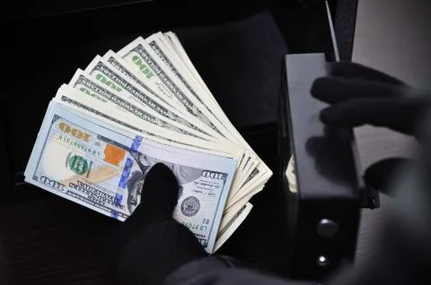Thief steals dollars Foto stock