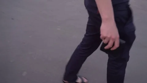 A thief steals a wallet from the hands of a young man Stock Footage 75444217