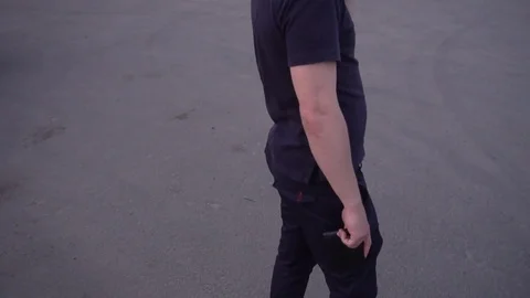 A thief steals a wallet from the hands of a young man Video stock 75444238