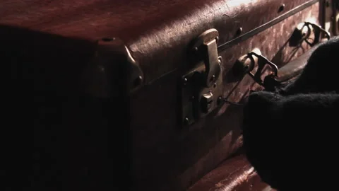 Thief tries to open the suitcase with a keylock-picking, wearing gloves Video stock 205099220