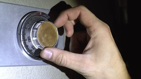 The thief is trying to open the safe Video stock 98555211