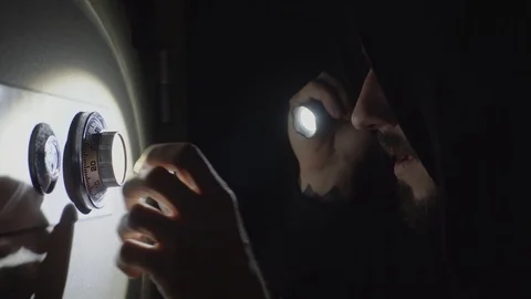 The thief is trying to open the safe Video stock 98555268