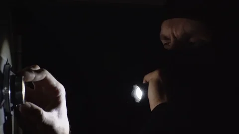 The thief is trying to open the safe Video stock 98555317