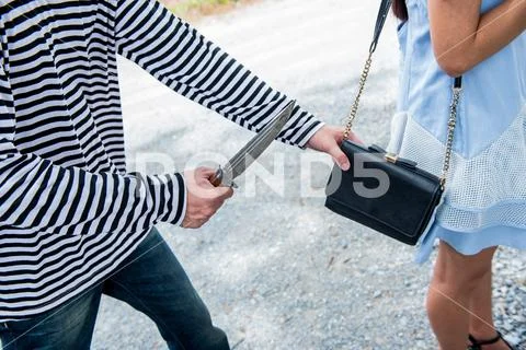 Thief is trying to steal at the public place Stock Photos