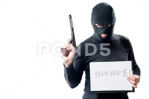 Thief with the weapon shows the sum of the ransom for the hostage Stock Photos