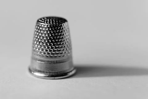 A thimble in close-up on white background Stock Photos