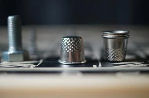 Thimbles on a chessboard Stock Photos