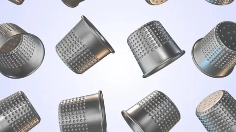 Thimbles Falling on a Light Blue Background. Stainless Steel Thimble 3D. 4K Stock Footage 301860588