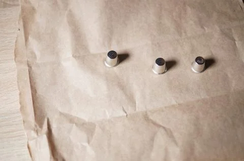 Thimbles on paper Stock Photos