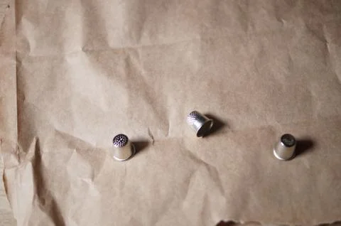 Thimbles on paper Stock Photos