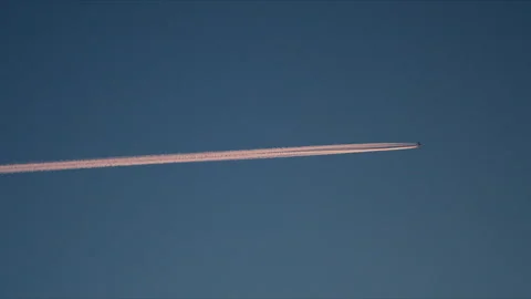 Thin Aircraft Contrail Extending Across Blue Arctic Sky in Norway Stock-Footage 336609410