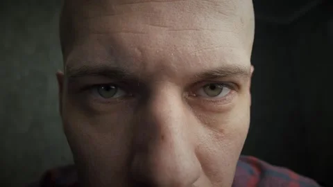 Thin bald man who opens his eyes and looks at the camera Stock Footage 260603509