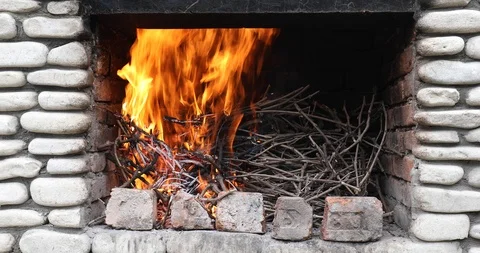 Thin Branches Ignite In The Fireplace Before Cooking Stock-Footage 116996334