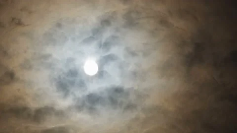Thin clouds are passing through the sun. Video stock 145703407